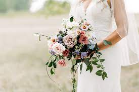 This type of bouquet consists of a simple gathering of flower tied with ribbon with stems. The Modern Garden Style Cascading Bouquet Winnipeg Wedding Florist Stone House Creative