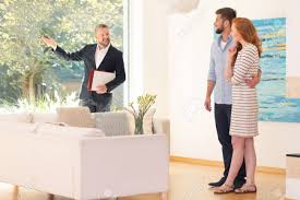 We're passionate about interiors, design and trends. Real Estate Agent Showing Home Interior For Sale To Young Couple Stock Photo Picture And Royalty Free Image Image 87588340