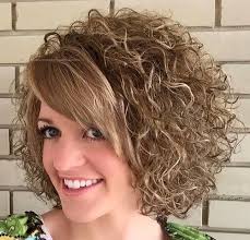 A permanent wave, commonly called a perm or permanent (sometimes called a curly perm to distinguish it from a straight perm), is a hairstyle consisting of waves or curls set into the hair. Perm With Straight Bangs Straight Bangs Curly Hair Short Permed Hair Natural Curls Hairstyles