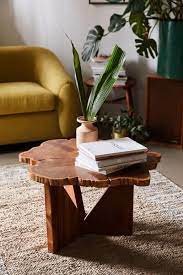 The glass table top keeps the look light and airy, making it a great option for a small space. Akina Live Edge Coffee Table Urban Outfitters