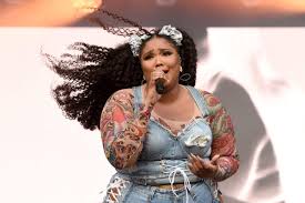 Lizzo awesome, cosmo not so much. Lizzo Doesn T Neglect To Give An Inspirational Message While Welcoming 2021 With Her Neon Pink Wig On From The Stage