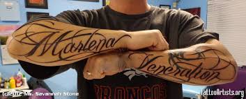 This is an arm tattoo design for those that enjoy vibrant colors along with the ability to pay tribute to a loved one. Arm Name Tattoo Ideas Name Tattoos On Arm Names Tattoos For Men Cool Tattoos For Guys