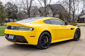 Image result for Sunburst Yellow 2012 Aston Martin