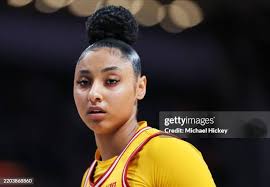 Avery Howell of the USC Trojans brings the ball up court during the... News  Photo