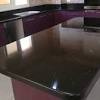 White granite countertops and neutral finishes or warm wooden cupboards, and black granite kitchen countertops. 1