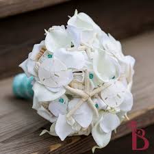 Sizes or colors you need, there is an orchid waiting to fill that role in your bouquet. 34 Seashell Bouquet Collection By The Bridal Flower Ideas Seashell Bouquet Bridal Flowers Wedding Hands
