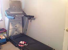 Extra closets can be used for storage, and repurposed dressers or bookshelves can hold items like balance balls. Hide A Treadmill