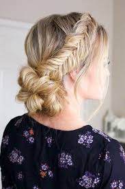 This side braid is breathtaking and it ends in a fishtail braid. Picture Of A Low Bun With Two Fishtail Side Braids And A Bump Is A Chic And Comfy To Wear Option
