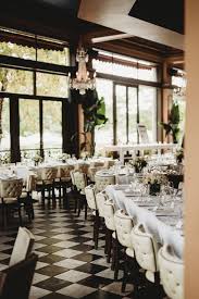 Black And White Restaurant Restaurant Reception Decorated With Greenery And Black And White Accents Cafe Lurcat White Restaurant Restaurant Wedding
