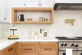 Gold Oak Bottom Cabinets Mismatch With White Upper Shaker Cabinets Accented With Matte Black Hardware In A Transitional Ki Upper Cabinets Kitchen Kitchen Space