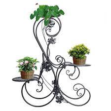 Buy plant pot stands and get the best deals at the lowest prices on ebay! Metal Plant Pot Stand Outdoor Elegant Raised Herb Floor Flower Display Rack Shelf With 3 Pots Holders Indoor Home Garden Patio Decor Black Buy Online In Bahamas At Bahamas Desertcart Com Productid 69615262