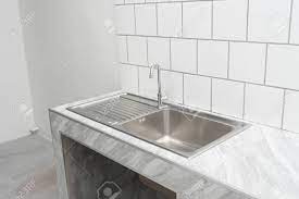 Needed to replace sink with same size and due to the low price i was hesitant this would be that good. Stainless Steel Kitchen Sink Detail On White Granite Worktop Stock Photo Picture And Royalty Free Image Image 153427086
