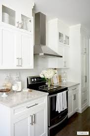 White And Grey Kitchen A Hardware Update Citrineliving In 2020 Modern White Kitchen Cabinets White Modern Kitchen White Shaker Kitchen Cabinets