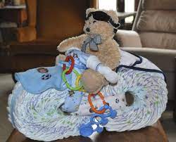 Unique Diaper Bike For Baby Shower Little Teddy Bear On Top Of Diaper Bike With Other Gifts Added Perfectly To Unique Baby Shower Diaper Bike Baby Shower Gifts