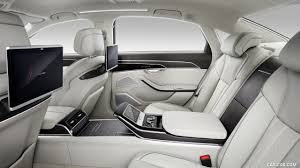 Interior designers crafted the wraparound interior to fi t within 120° of our vision. 2018 Audi A8 L Interior Rear Seats Caricos