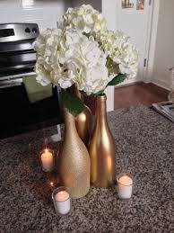 This easy diy will transform trash into treasure—just watch as your guests ooh and ahh at this wine bottle centerpiece! Wine Bottle Centerpiece Mock Up Complete Weddingbee Wine Bottle Centerpieces Bottle Centerpieces Wedding Wine Bottles