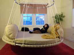 This diy hanging bed project is perfect for a back porch or summer home. Daybed Outdoor Bed Canopy Bed The Floating Bed Co Trampoline Bed Outdoor Bed Swing Bed Design