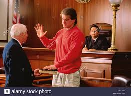 Image result for PIC OF MAN TAKING OATH IN COURT BY PUTTING HAND ON BIBLE