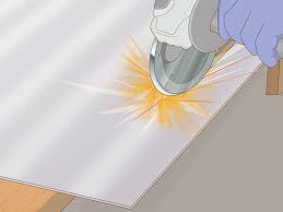 Cutting galvanized sheets start by clamping the sheet of the galvanized steel securely by using a bench vice with guidelines facing upwards. 3 Simple Ways To Cut Corrugated Metal Wikihow