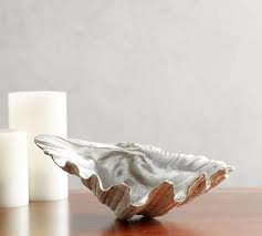 Coastal room by kate jackson design, placing a giant clam shell on the coffee table. Large Clam Shell Table Decor