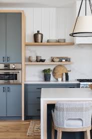 Want to know how much vertical shiplap cost for our room? Hanging Shade Over Blue Island Transitional Kitchen