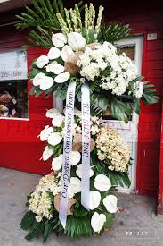At the passing of a friend or family member, flowers can serve as an ideal tribute to the memory of the. Standing Arrangement Of White Anthuriums Mums Alstroemerias Tuberoses Sympathy Funeral Flowers Flower Patch Online Flower Delivery Phillippines