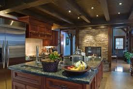 This dreamy mountain kitchen features sleek black shaker cabinets with large wood beams, a natural stone accent wall, and plenty of overhead lighting to keep the space bright. 40 Magnificent Kitchen Designs With Dark Cabinets Architecture Design