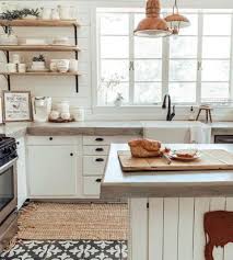 A moody black kitchen with a red brick backsplash that enlivens the space and makes it bolder and cooler. 57 Concrete Kitchen Countertop Ideas Digsdigs