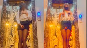 中国人のレディーボーイは残業中にエレベーターのドアで射精せずにはいられなかった