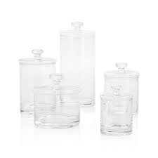 Container is made of glass; Set Of 5 Glass Canisters Reviews Crate And Barrel In 2021 Glass Canisters Clear Glass Canisters Glass Bathroom