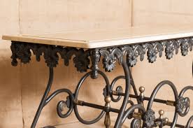 This beautiful table elevates your home accents by bringing a modern feel to your home. French Iron Butcher Or Pastry Table With Marble Top