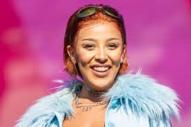 Amala ratna zandile dlamini (born on october 21, 1995 in calabasas, california), better known by her stage name doja cat, is a rapper, singer, songwriter. Doja Cat Is Chic In Zoot Suit Backless Bralette Square Toe Sandals Footwear News