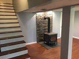Unless you have an insulated basement, you're going to lose a lot of heat through the foundation walls before you ever get a chance to enjoy it upstairs. Basement Cardroom On Greenfield Rd Zeus Building