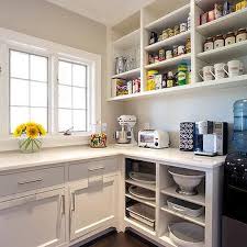 The lower cabinets are simple and have circular handles to open and close them. Open Kitchen Cabinets Design Ideas