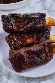 These Easy Oven Baked Jerk Beef Ribs Are Seasoned To The Bone Slow Braised Tender And Juicy These Ribs Will Be A Baked Beef Ribs Beef Ribs Beef Ribs Recipe