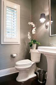 Use Lighting To Increase Space In A Small Bathroom Easy Ways To Make A Small Bathroom Look Larger F Half Bathroom Small Bathroom Remodel Bathroom Wallpaper