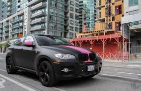 Black And Pink Car Paint Bmw X6 Wrapped In Matte Black With Pink Stripes Pink Bmw Bmw Bmw X Series