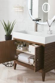 A grey accent wall brings the eyes to the mirror and sinks. Linear 36 Single Bathroom Vanity Mid Century Walnut