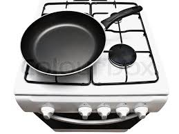 Coal gas, electric stove, wok, coal, hearth, gas stove, black board, kitchenware, frying pan, natural gas. Frying Pan At The White Gas Stove Over Stock Image Colourbox