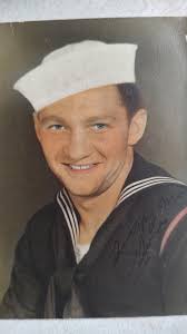 Can someone edit my Navy pictures to add a United States flag background  and fix my eye and hair?