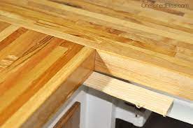 Most cabinet manufacturers provide corner blocks within the cabinet for attaching the countertop to the cabinet base. How To Finish And Install Butcher Block Countertop Cherished Bliss
