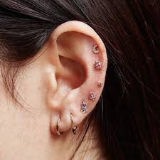 An ear piercing chart which walks you through every single type of ear piercing, including images there are so many types of ear piercing setups that it can be extremely difficult to choose the one. Diamond Moon Threaded Stud Maria Tash