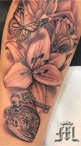 Woman S Arm Tattoo Flower Butterfly Heart Locket Tattoo By Big G Miamibeach Miamitattoos Miami Heart Locket Tattoo Floral Tattoo Shoulder Locket Tattoos