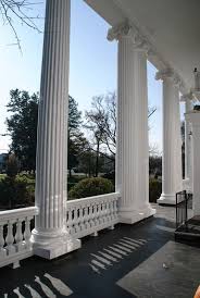 A groove or channel, esp. Round Fluted Columns Royal Corinthian