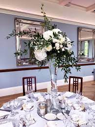 Tall Wedding Centrepiece With White Hydrangeas And Roses Tall Wedding Centerpieces Wedding Centerpieces Tall Centerpieces