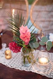 Tropical Pink Flower Palm And Eucalyptus Centerpiece Dining Hosting Wedding Flower Centerpieces Wedding Wedding Floral Centerpieces Wedding Centerpieces