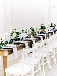 Farmhouse Head Table At An All White Barn Venue In Texas Farmhouse Wedding Table Chair And Table Rental Wedding Table Settings