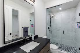 This basement bathroom does double duty as the bath for a guest bedroom and an exercise space. Basement Bathroom Renovation Ideas Designs Cost For Small Large
