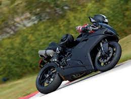 Matte Black Ducati Motorcycle On The Turn Ducati Motorcycles Ducati Motorcycle