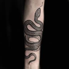 This snake tattoo in pure black stands out for its effective shading work that gives this tattoo a photographic quality that is hard to beat. 60 Best Snake Tattoos Collection